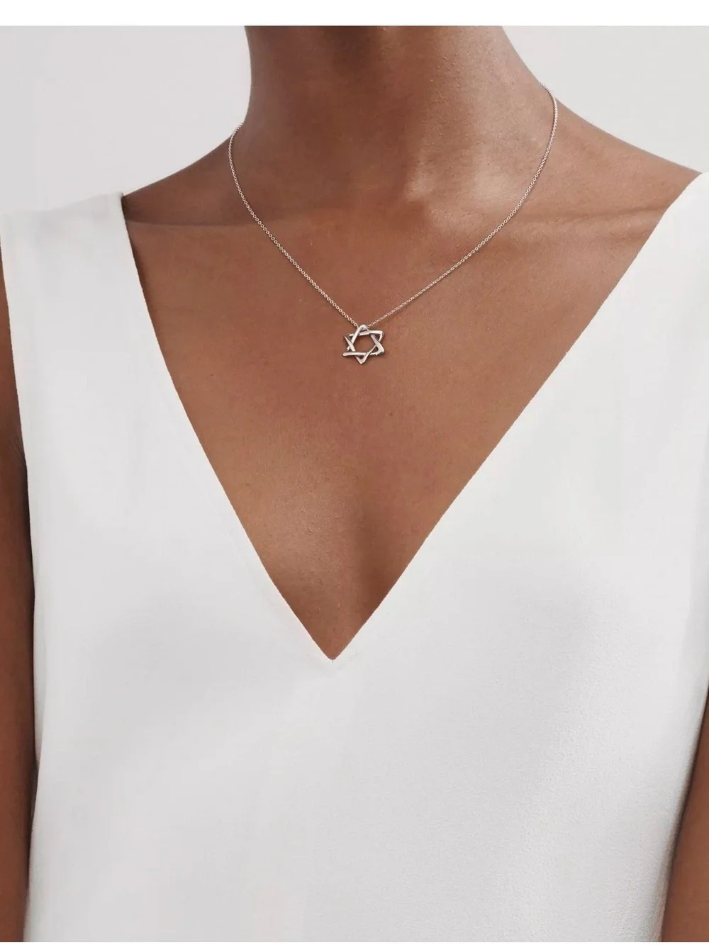 Tiffany & Co. Sterling Silver Star of David with Certificate of Authenticity.